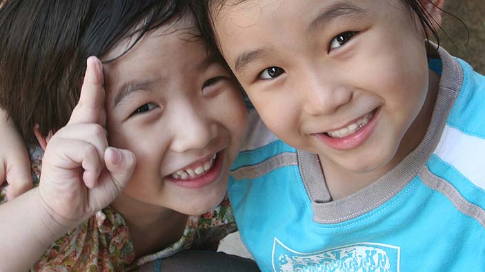 Two children smiling