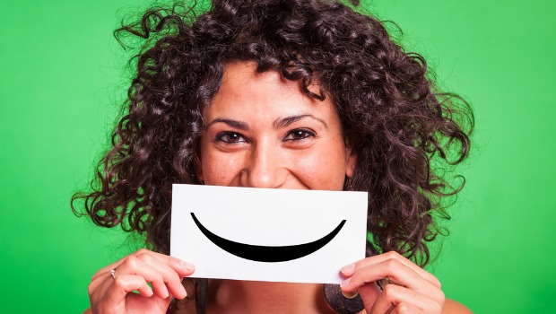 Woman with paper smile