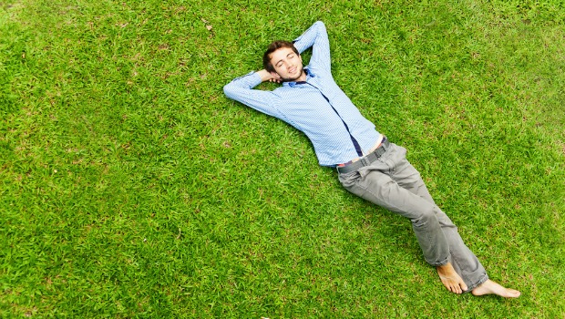 Guy relaxing on the grass