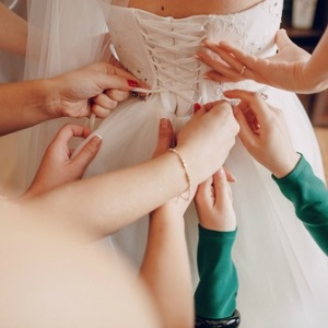 lacing up a wedding dress