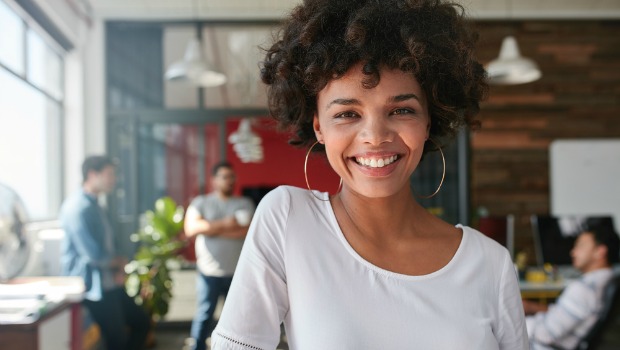 Smiling woman who is happy at work