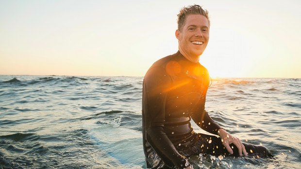 Happy guy on a surfboard