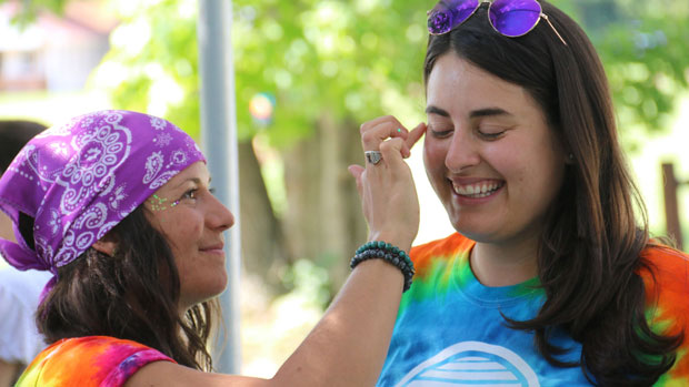 Woman getting her face painted.