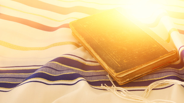 Jewish prayer book and talit.
