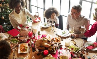 Blended family eating together for the holidays