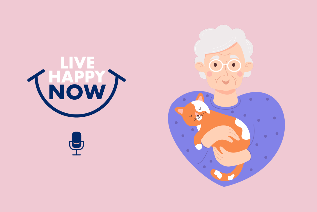 An elderly lady holding her cat.